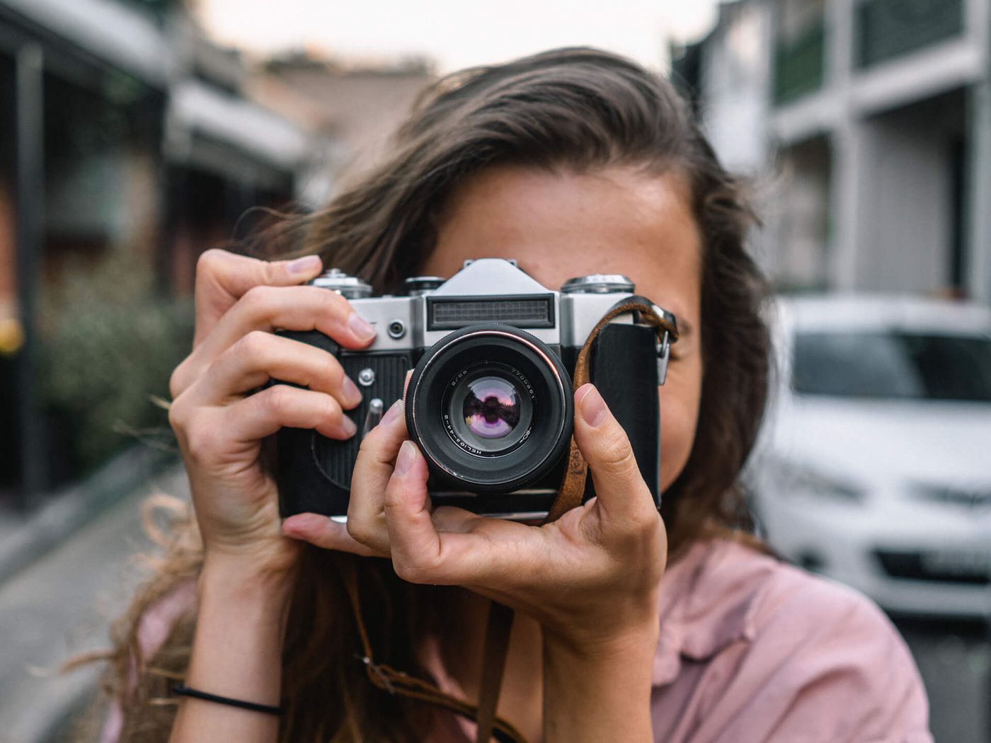 Photographer with a camera — Pixme AI photo enhancement